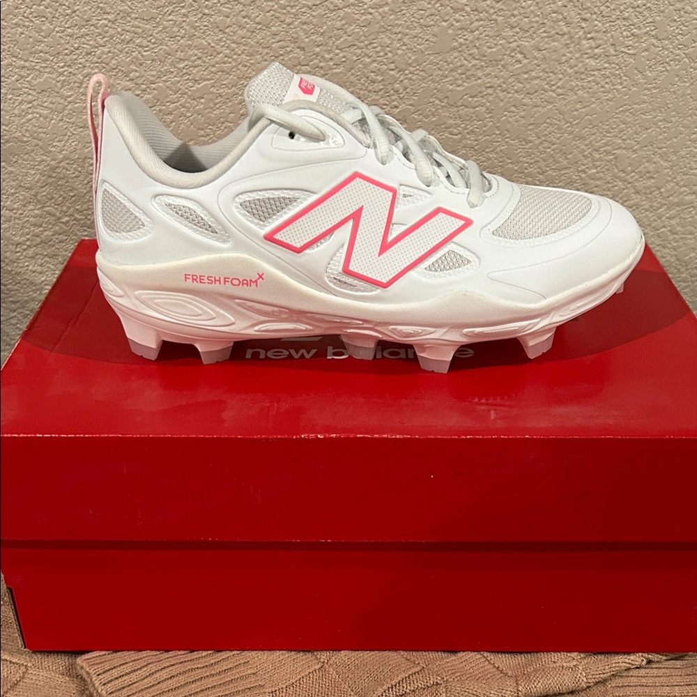 New Balance White and Pink Sports Cleats